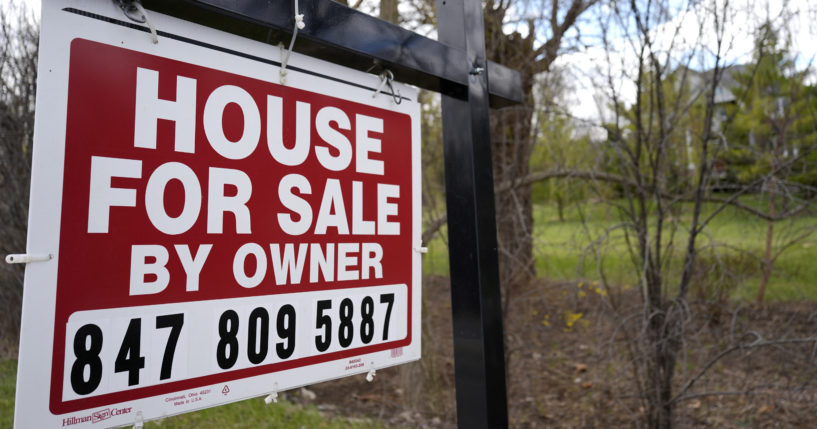 A sign announcing a house for sale is displayed in Prospect Heights, Illinois, on March 18.