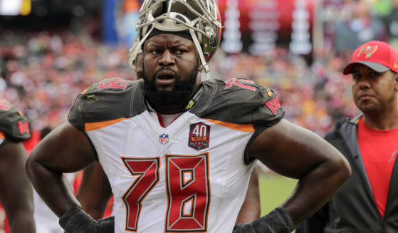 Tampa Bay Buccaneers tackle Gosder Cherilus walks off the field at halftime during the first half of an NFL football game against the Washington Redskins in Landover, Maryland, on Oct. 25, 2015.