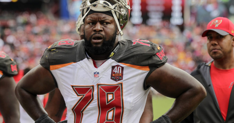 Tampa Bay Buccaneers tackle Gosder Cherilus walks off the field at halftime during the first half of an NFL football game against the Washington Redskins in Landover, Maryland, on Oct. 25, 2015.