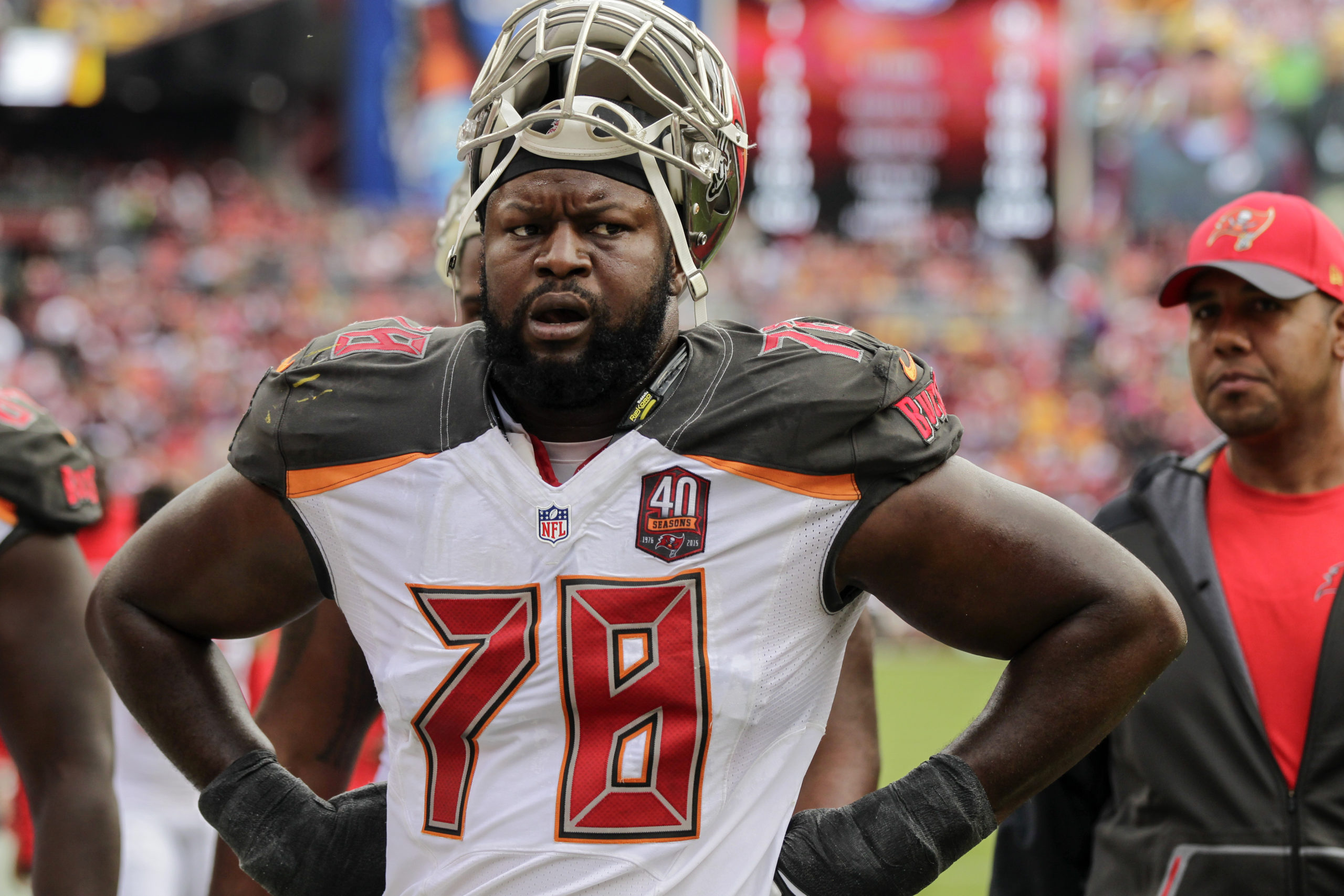 Tampa Bay Buccaneers tackle Gosder Cherilus walks off the field at halftime during the first half of an NFL football game against the Washington Redskins in Landover, Maryland, on Oct. 25, 2015.