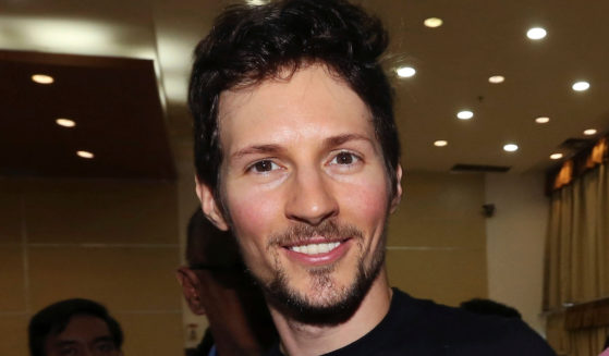 Telegram co-founder Pavel Durov, center, smiles following his meeting with Indonesian Communication and Information Minister Rudiantara in Jakarta, Indonesia on August 1, 2017.