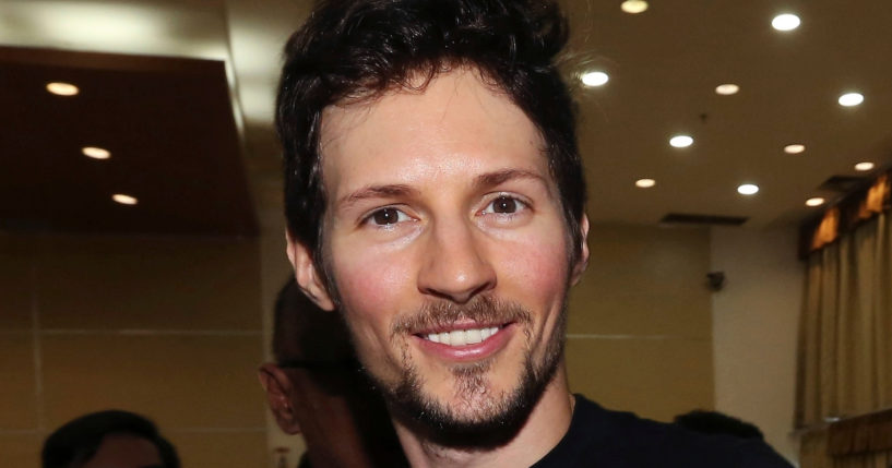 Telegram co-founder Pavel Durov, center, smiles following his meeting with Indonesian Communication and Information Minister Rudiantara in Jakarta, Indonesia on August 1, 2017.