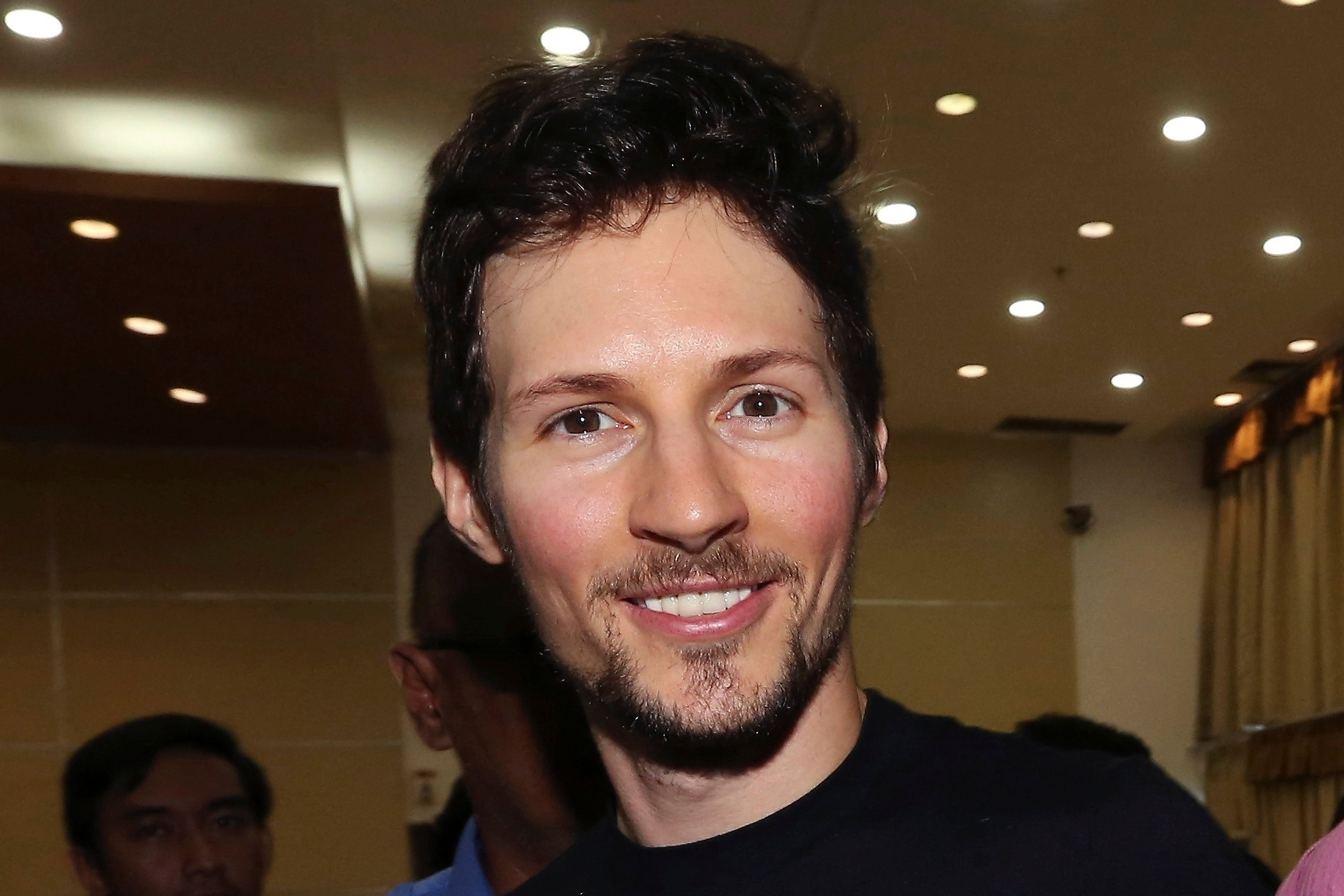 Telegram co-founder Pavel Durov, center, smiles following his meeting with Indonesian Communication and Information Minister Rudiantara in Jakarta, Indonesia on August 1, 2017.