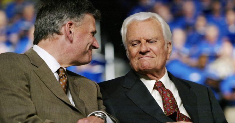 Father and son evangelists Franklin Graham and the late Billy Graham are pictured in a 2003 file photo in Oklahoma City, Oklahoma.