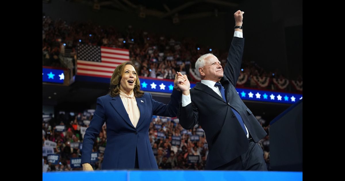 Democratic presidential candidate, U.S. Vice President Kamala Harris and Democratic vice presidential candidate Minnesota Gov. Tim Walz greet supporters during a campaign event at the Liacouras Center at Temple University on August 6, 2024 in Philadelphia, Pennsylvania.