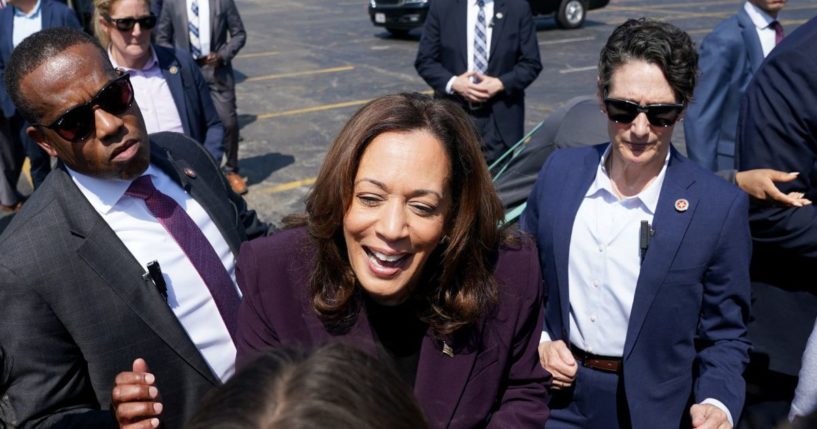 US Vice President and 2024 Democratic presidential candidate Kamala Harris greets supporters on her way to board Marine Two as she departs from the Soldier Field landing zone in Chicago, Illinois on August 23, 2024.