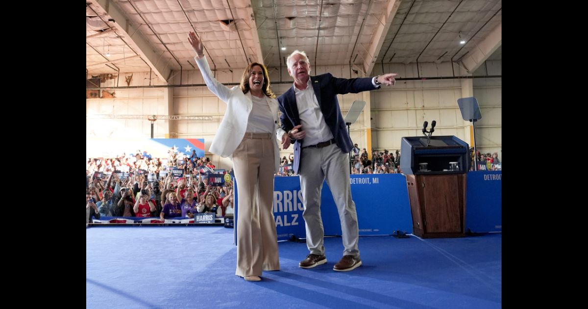 Democratic presidential candidate, U.S. Vice President Kamala Harris and Democratic vice presidential candidate Minnesota Gov. Tim Walz appear on stage together during a campaign event on August 7, 2024 in Detroit, Michigan.