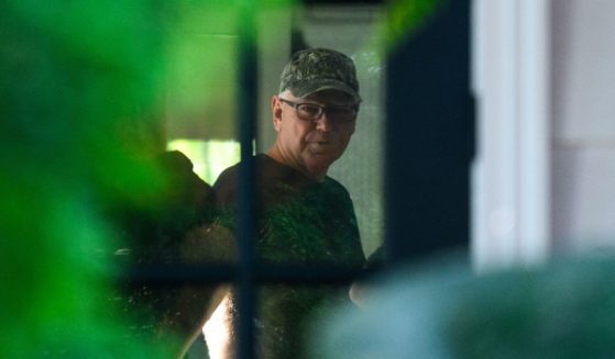 Democratic vice presidential nominee Minnesota Governor Tim Walz prepares to depart from his temporary Governors residence for a campaign rally in Philadelphia on August 6, 2024 in St Paul, Minnesota.