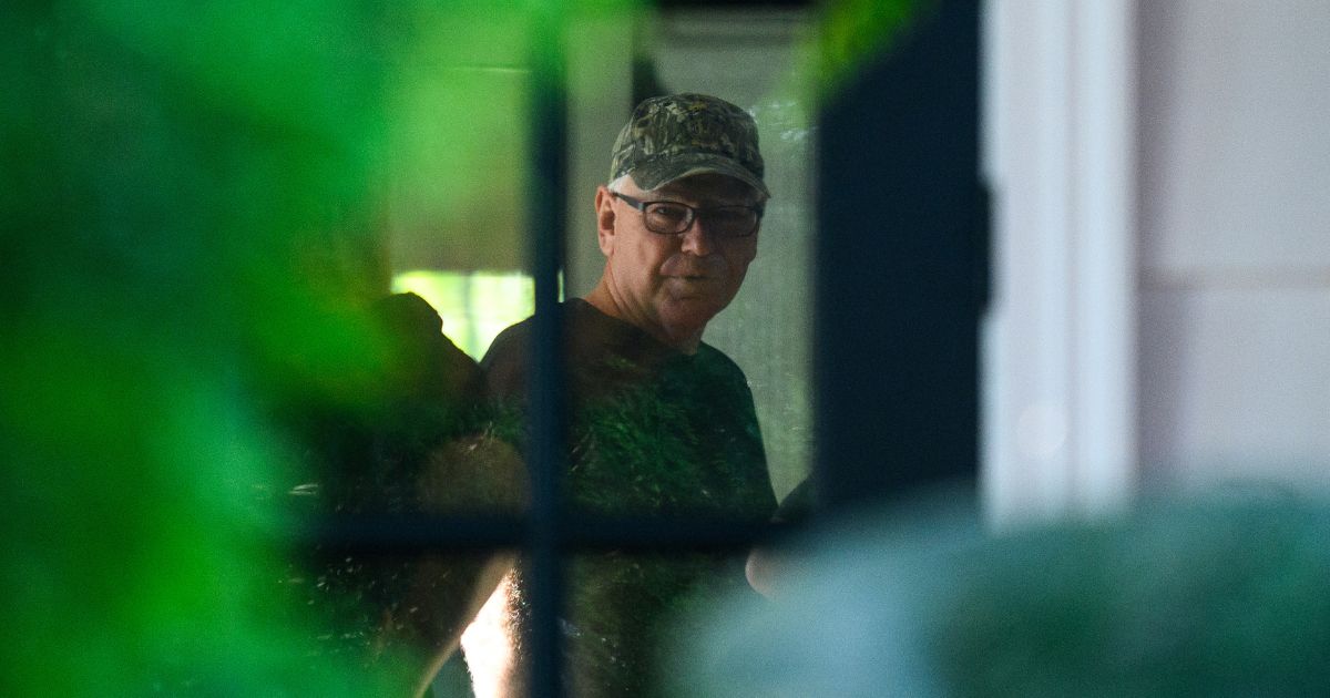 Democratic vice presidential nominee Minnesota Governor Tim Walz prepares to depart from his temporary Governors residence for a campaign rally in Philadelphia on August 6, 2024 in St Paul, Minnesota.