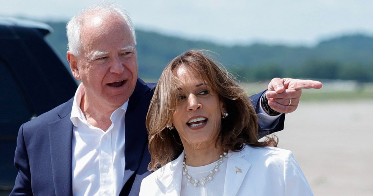 Vice President and 2024 Democratic presidential candidate Kamala Harris, right, and her running mate Minnesota Gov. Tim Walz, left, arrive at Chippewa Valley Regional Airport in Eau Claire, Wisconsin, on Wednesday.