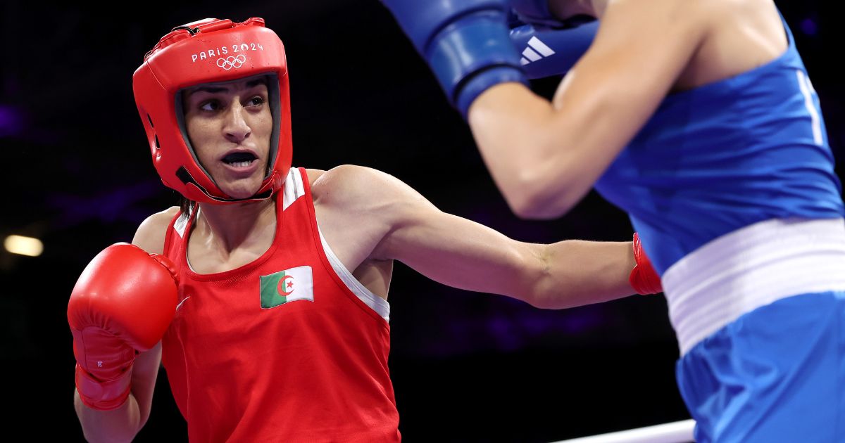 Imane Khelif of Team Algeria punches Angela Carini of Team Italy during the Women's. 66kg preliminary round match on day six of the Olympic Games Paris 2024 at North Paris Arena on August 1, 2024 in Paris, France.