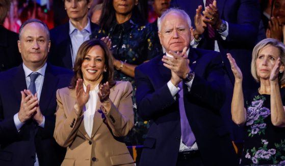 Second Gentleman Doug Emhoff, far left; Vice President Kamala Harris, middle left; Democratic vice presidential candidate Minnesota Gov. Tim Walz, middle right; and Minnesota first lady Gwen Walz, far right, attend the first day of the Democratic National Convention at the United Center on Aug.19 in Chicago, Illinois.