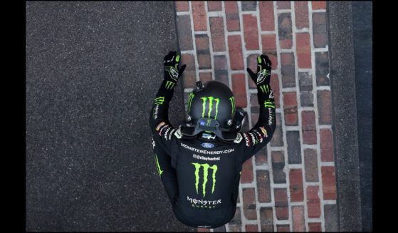 Riley Herbst, driver of the #98 Monster Energy Ford, celebrates after winning the NASCAR Xfinity Series Pennzoil 250 at Indianapolis Motor Speedway on July 20, 2024 in Indianapolis, Indiana.