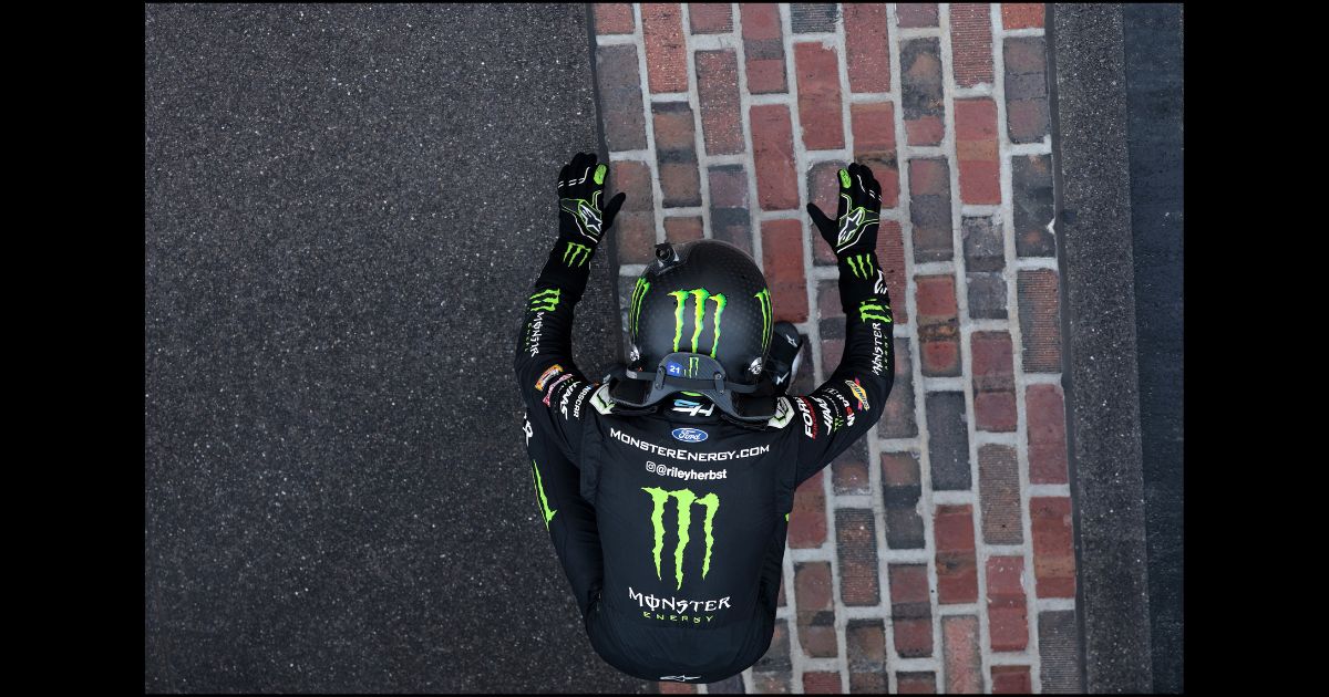 Riley Herbst, driver of the #98 Monster Energy Ford, celebrates after winning the NASCAR Xfinity Series Pennzoil 250 at Indianapolis Motor Speedway on July 20, 2024 in Indianapolis, Indiana.