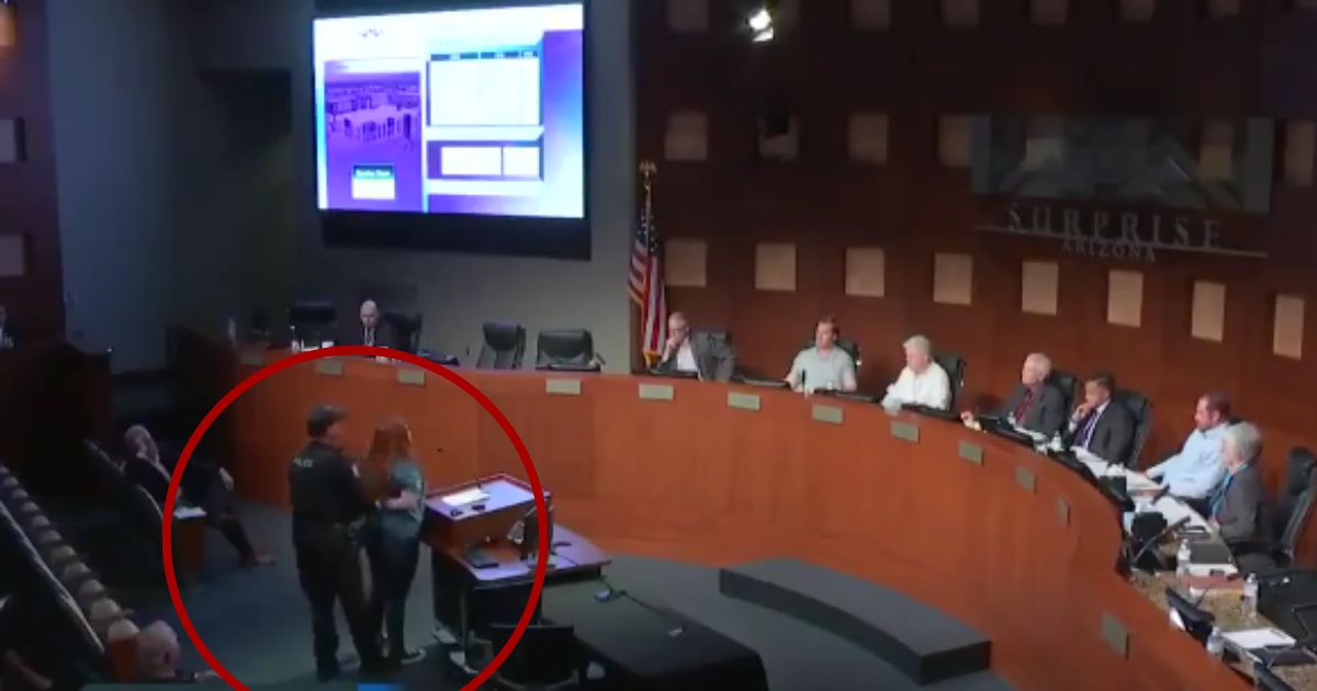 The mayor of Surprise, Arizona, Skip Hall, had Rebekah Massie, circled, arrested during a city council meeting on Aug. 20, while she was criticizing the pay of some city council officials.