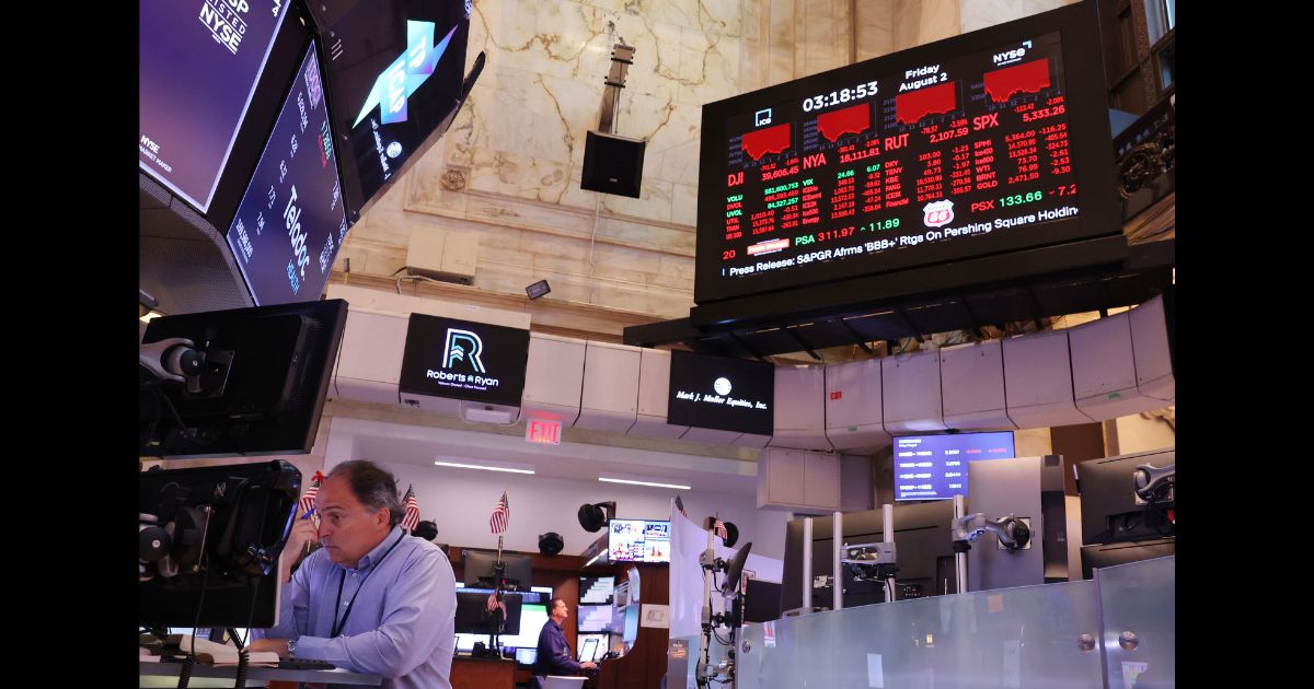 Traders work on the floor of the New York Stock Exchange during afternoon trading on August 2, 2024 in New York City.