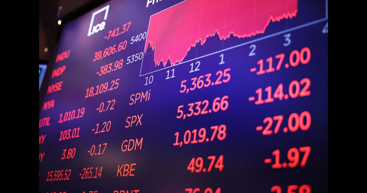 Stock market numbers are displayed on a screen at the New York Stock Exchange during afternoon trading on August 2, 2024 in New York City.