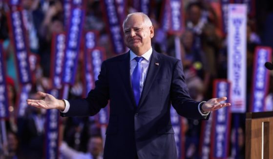 Democratic vice presidential nominee Minnesota Gov. Tim Walz reacts after accepting the vice presidential nomination during the third day of the Democratic National Convention at the United Center on August 21, 2024 in Chicago, Illinois.