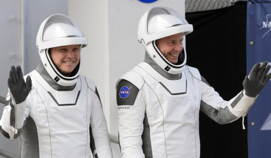 Astronauts preparing to enter space.