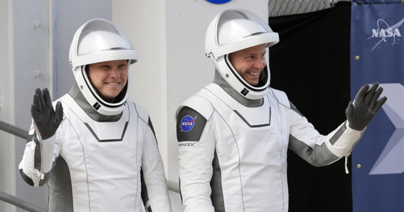 Astronauts preparing to enter space.