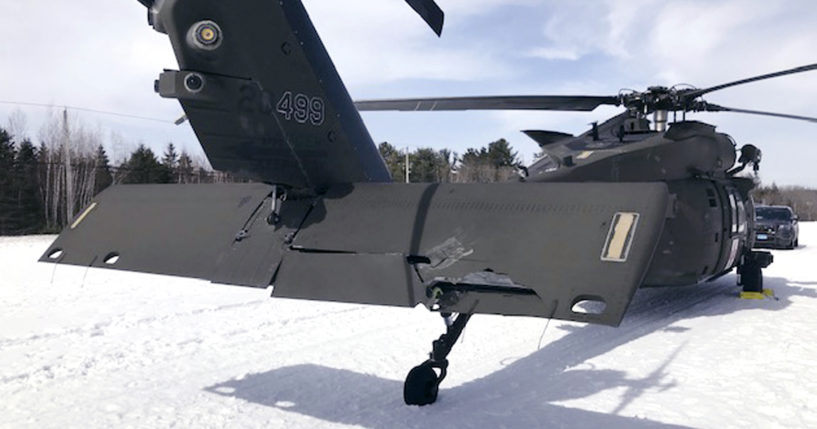 This photograph shows a damaged Black Hawk helicopter resting in the snow in Worthington, Massachusetts, on March 13, 2019.