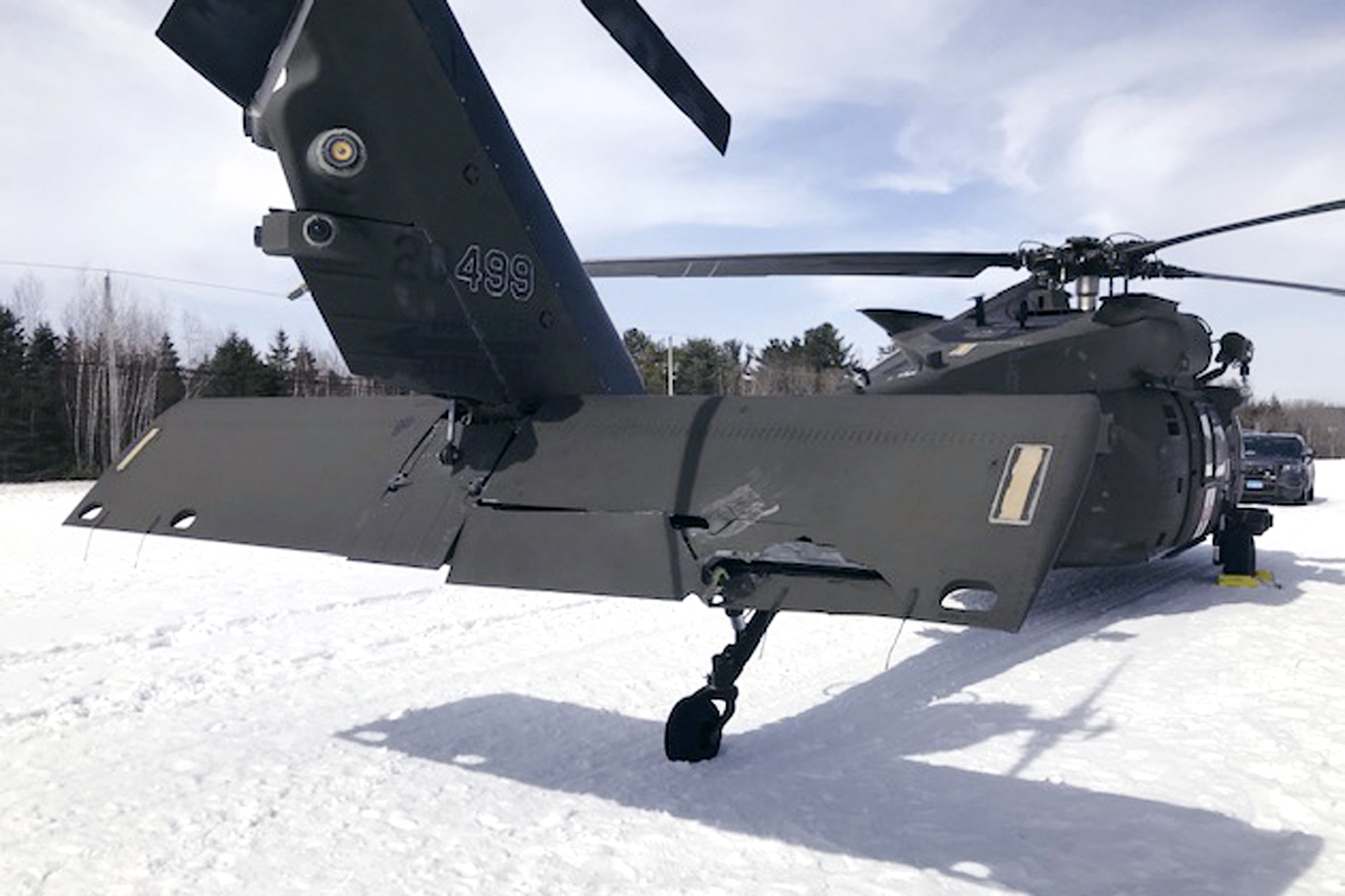 This photograph shows a damaged Black Hawk helicopter resting in the snow in Worthington, Massachusetts, on March 13, 2019.