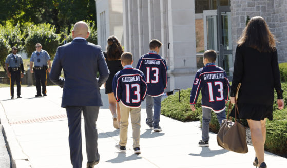 Young attendees wear Johnny Gaudreau's Columbus Blue Jackets jersey to the funeral services for Johnny Gaudreau and Matthew Gaudreau at Saint Mary Magdalen Church in Media, Pennsylvania, on Monday.