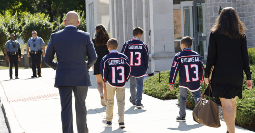 Young attendees wear Johnny Gaudreau's Columbus Blue Jackets jersey to the funeral services for Johnny Gaudreau and Matthew Gaudreau at Saint Mary Magdalen Church in Media, Pennsylvania, on Monday.