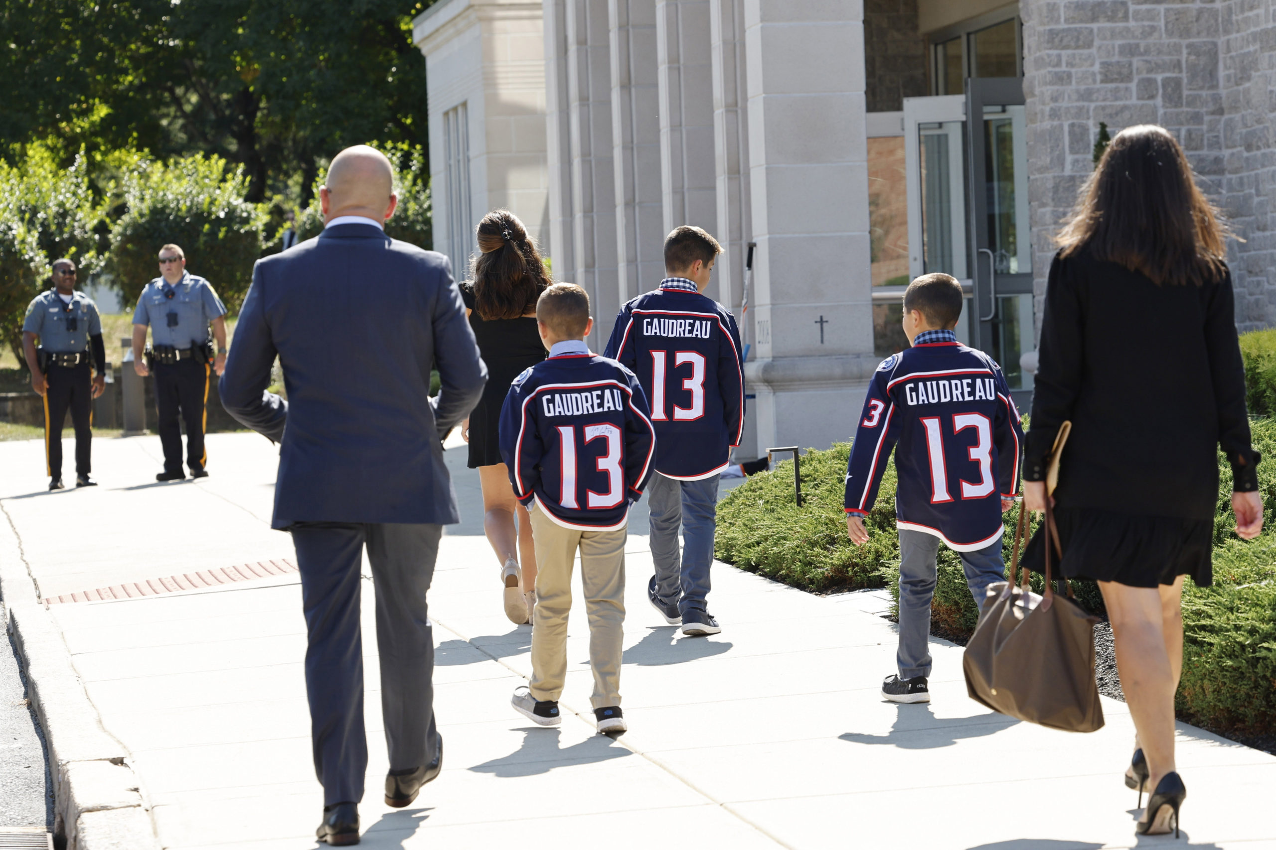 Young attendees wear Johnny Gaudreau's Columbus Blue Jackets jersey to the funeral services for Johnny Gaudreau and Matthew Gaudreau at Saint Mary Magdalen Church in Media, Pennsylvania, on Monday.