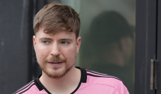 Jimmy Donaldson, the popular YouTube video maker who goes by MrBeast, wears a Lionel Messi jersey as he stands in a sideline box at the start of an MLS soccer match between Inter Miami and CF Montreal Sunday, March 10, 2024, in Fort Lauderdale, Florida.