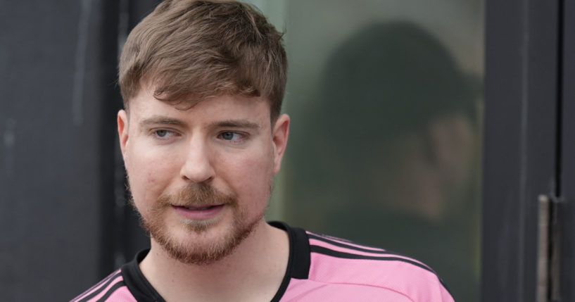 Jimmy Donaldson, the popular YouTube video maker who goes by MrBeast, wears a Lionel Messi jersey as he stands in a sideline box at the start of an MLS soccer match between Inter Miami and CF Montreal Sunday, March 10, 2024, in Fort Lauderdale, Florida.