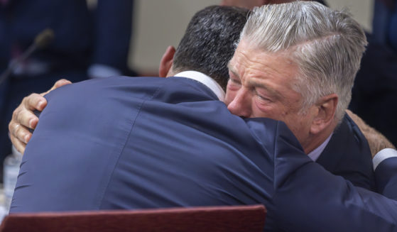 Actor Alec Baldwin, right, hugs his defense attorney Alex Spiro after District Court Judge Mary Marlowe Sommer threw out the involuntary manslaughter case, July 12, 2024, in Santa Fe, New Mexico, for the 2021 fatal shooting of cinematographer Halyna Hutchins during filming of the Western movie "Rust."