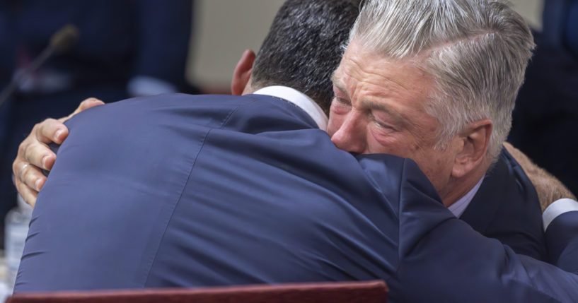 Actor Alec Baldwin, right, hugs his defense attorney Alex Spiro after District Court Judge Mary Marlowe Sommer threw out the involuntary manslaughter case, July 12, 2024, in Santa Fe, New Mexico, for the 2021 fatal shooting of cinematographer Halyna Hutchins during filming of the Western movie "Rust."