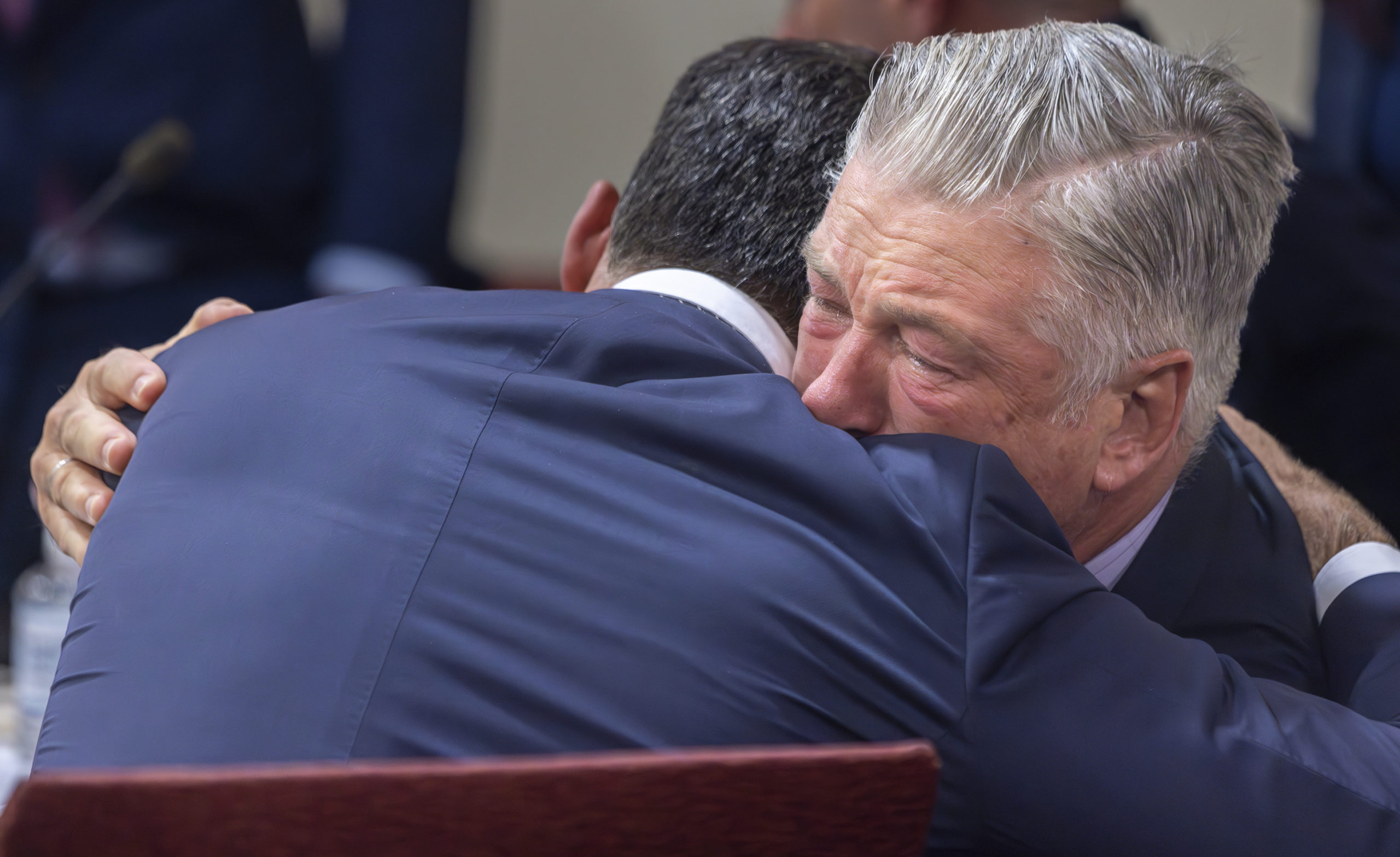 Actor Alec Baldwin, right, hugs his defense attorney Alex Spiro after District Court Judge Mary Marlowe Sommer threw out the involuntary manslaughter case, July 12, 2024, in Santa Fe, New Mexico, for the 2021 fatal shooting of cinematographer Halyna Hutchins during filming of the Western movie "Rust."