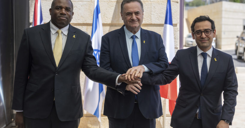 Britain's Foreign Secretary David Lammy, left, and French Foreign Minister Stéphane Séjourné, right, are welcomed by Israeli Minister of Foreign Affairs Israel Katz, at their meeting in Jerusalem in Aug. 16.