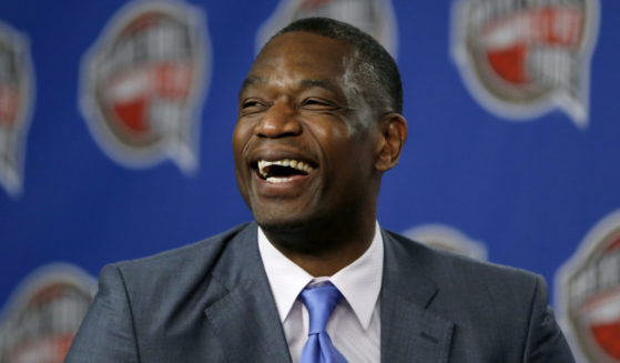 Former NBA player Dikembe Mutombo laughs during a news conference announcing him as one of the 12 finalists of this year's hall of fame class during an event ahead of the NBA All Star basketball game, on Feb. 14, 2015, in New York.