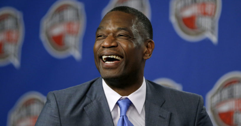 Former NBA player Dikembe Mutombo laughs during a news conference announcing him as one of the 12 finalists of this year's hall of fame class during an event ahead of the NBA All Star basketball game, on Feb. 14, 2015, in New York.