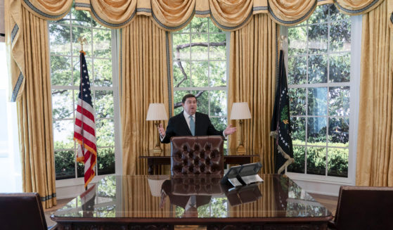 White House Historical Association President Stewart McLaurin shows members of the media a replica of the Oval Office at The People's House exhibit in Washington, D.C.