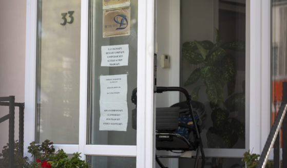 This shows a sign featuring the names of several companies on the door of a house where a Hungarian company that allegedly manufactured pagers that exploded in Lebanon and Syria is headquartered in Budapest Wednesday, September 18, 2024.