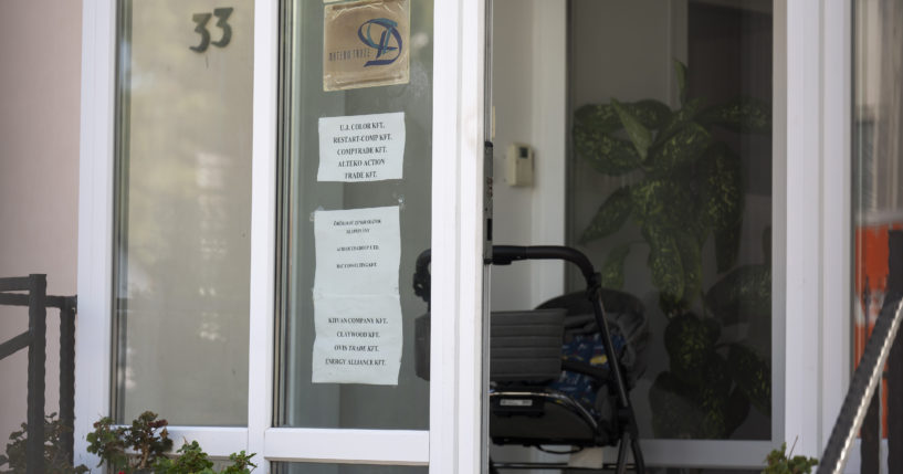 This shows a sign featuring the names of several companies on the door of a house where a Hungarian company that allegedly manufactured pagers that exploded in Lebanon and Syria is headquartered in Budapest Wednesday, September 18, 2024.