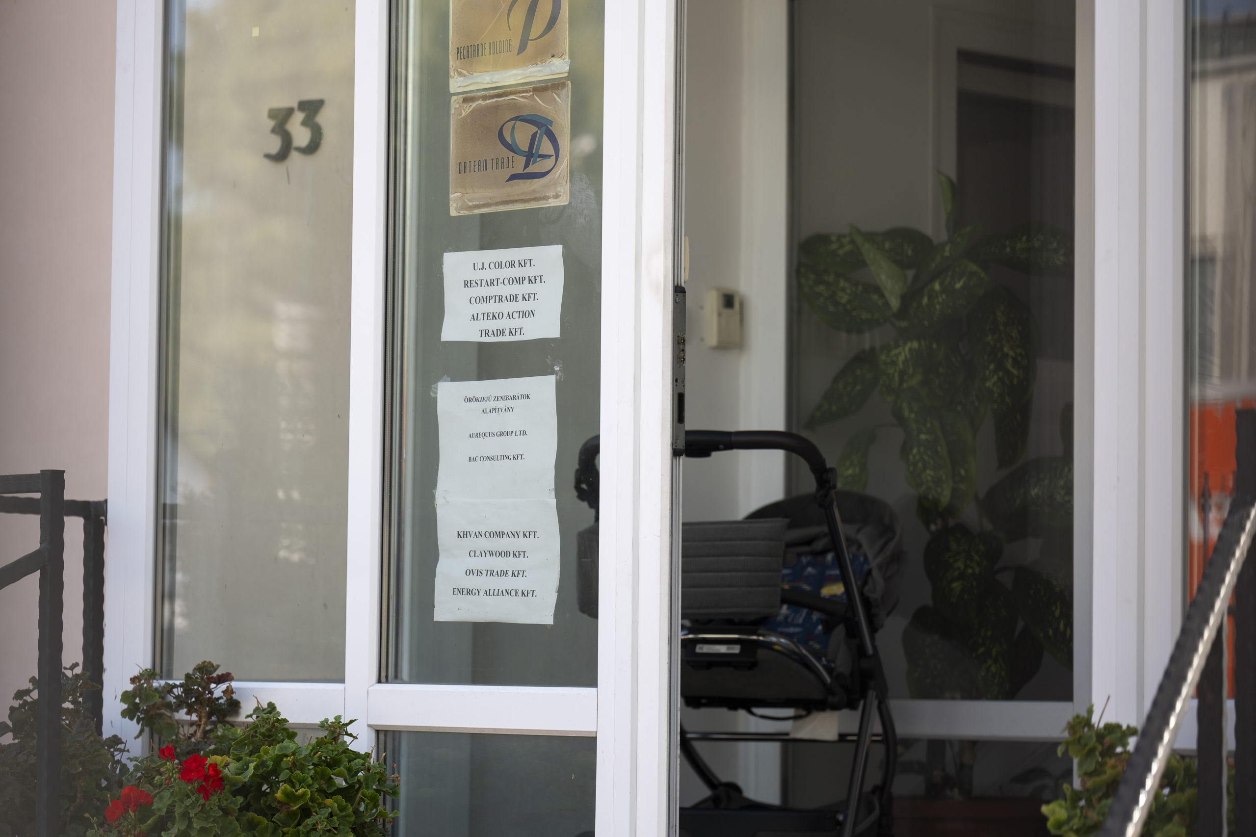 This shows a sign featuring the names of several companies on the door of a house where a Hungarian company that allegedly manufactured pagers that exploded in Lebanon and Syria is headquartered in Budapest Wednesday, September 18, 2024.