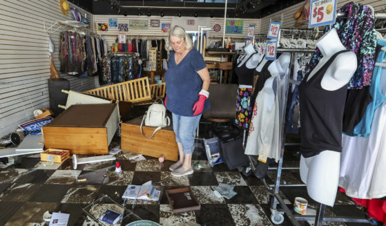 A Florida resident assesses the damage after Hurricane Helene.