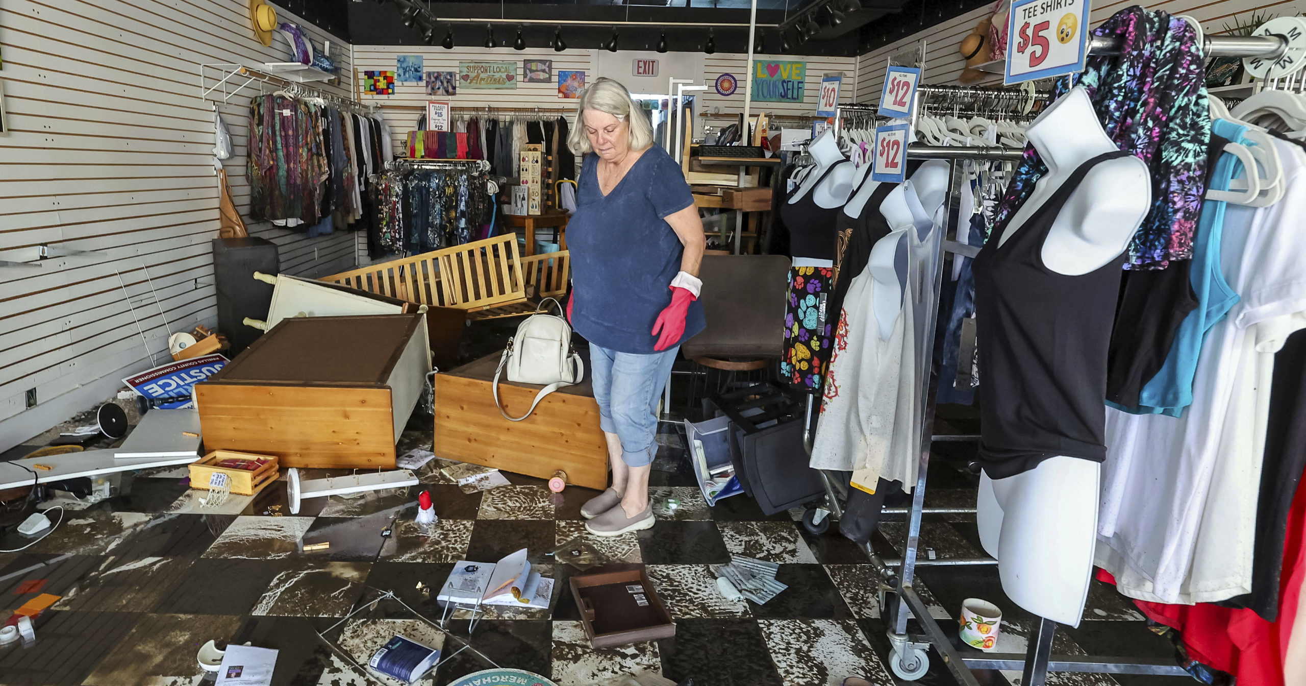 A Florida resident assesses the damage after Hurricane Helene.