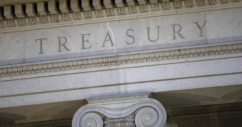 This June 6, 2019, file photo shows the U.S. Treasury Department building at dusk in Washington.