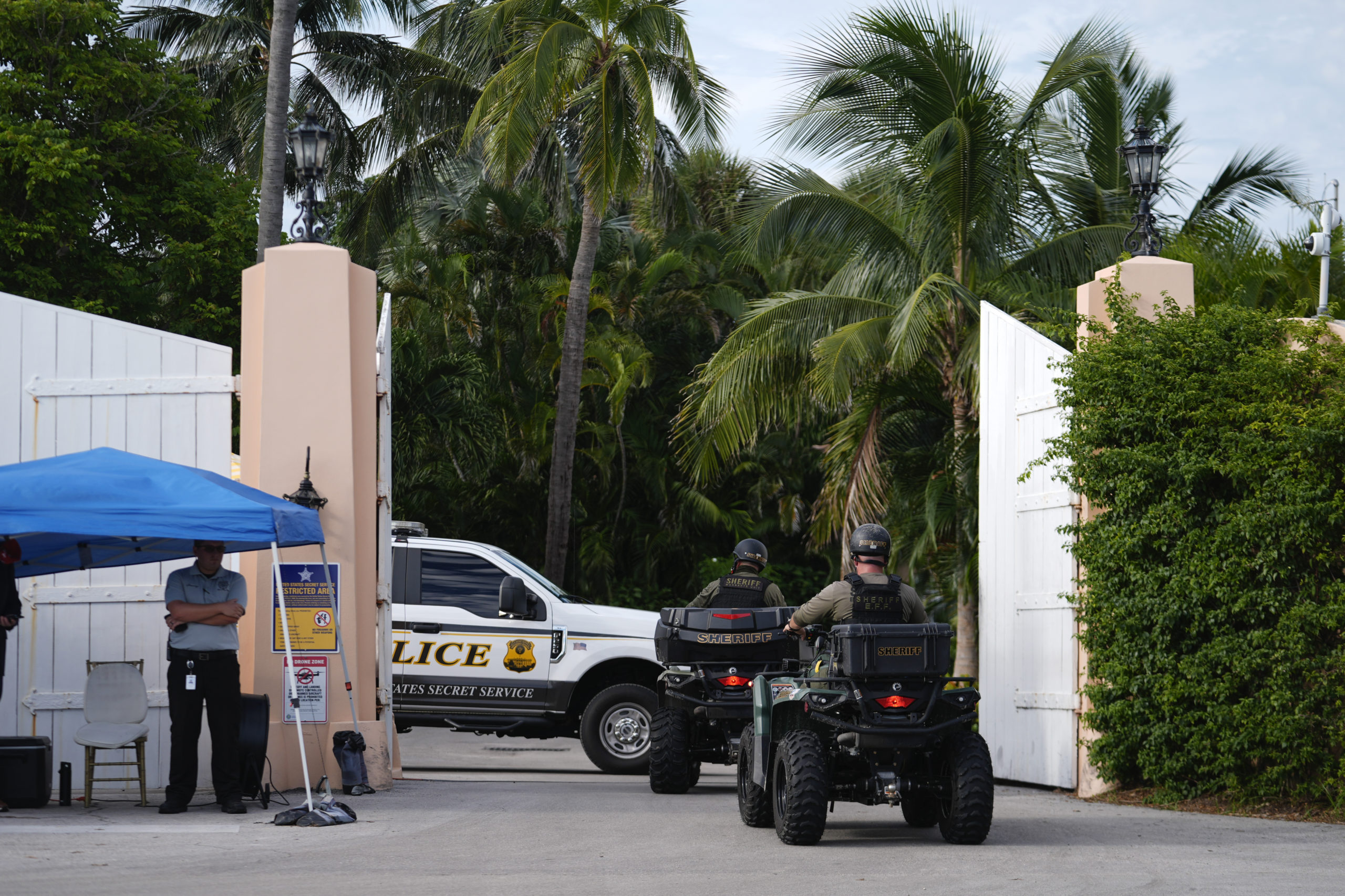 Police drive in to the Mar-a-Lago estate of Republican presidential nominee and former President Donald Trump, one day after an apparent assassination attempt, in Palm Beach, Florida on Monday.