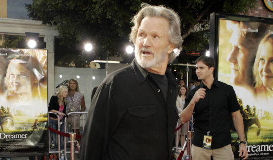 Actor Kris Kristofferson walks down the red carpet during the premiere of his new movie 