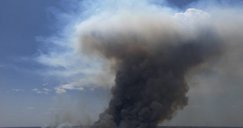 Smoke rises from fire in the environmentally protected area of Brasilia National Park during the dry season in Brasilia, Brazil on Monday. The head of the agency that manages protected areas, Mauro Pires, told the local press that the fire is man-made and appears to have started near the edge of a farm.