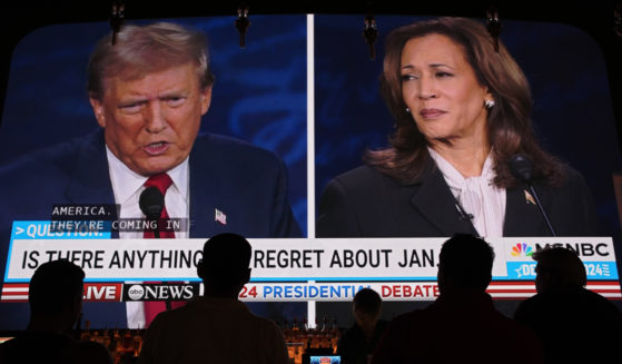 People watch the presidential debate between Republican presidential nominee former President Donald Trump and Democratic presidential nominee Vice President Kamala Harris on Tuesday at the Gipsy Las Vegas in Las Vegas, Nevada.