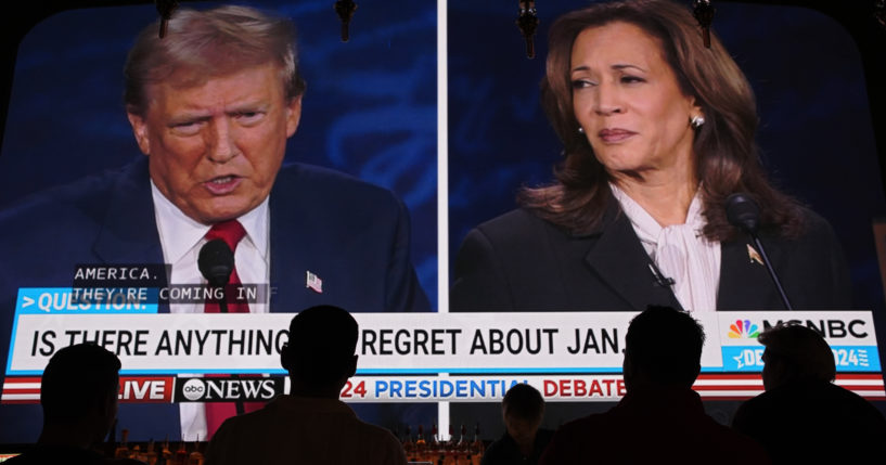 People watch the presidential debate between Republican presidential nominee former President Donald Trump and Democratic presidential nominee Vice President Kamala Harris on Tuesday at the Gipsy Las Vegas in Las Vegas, Nevada.