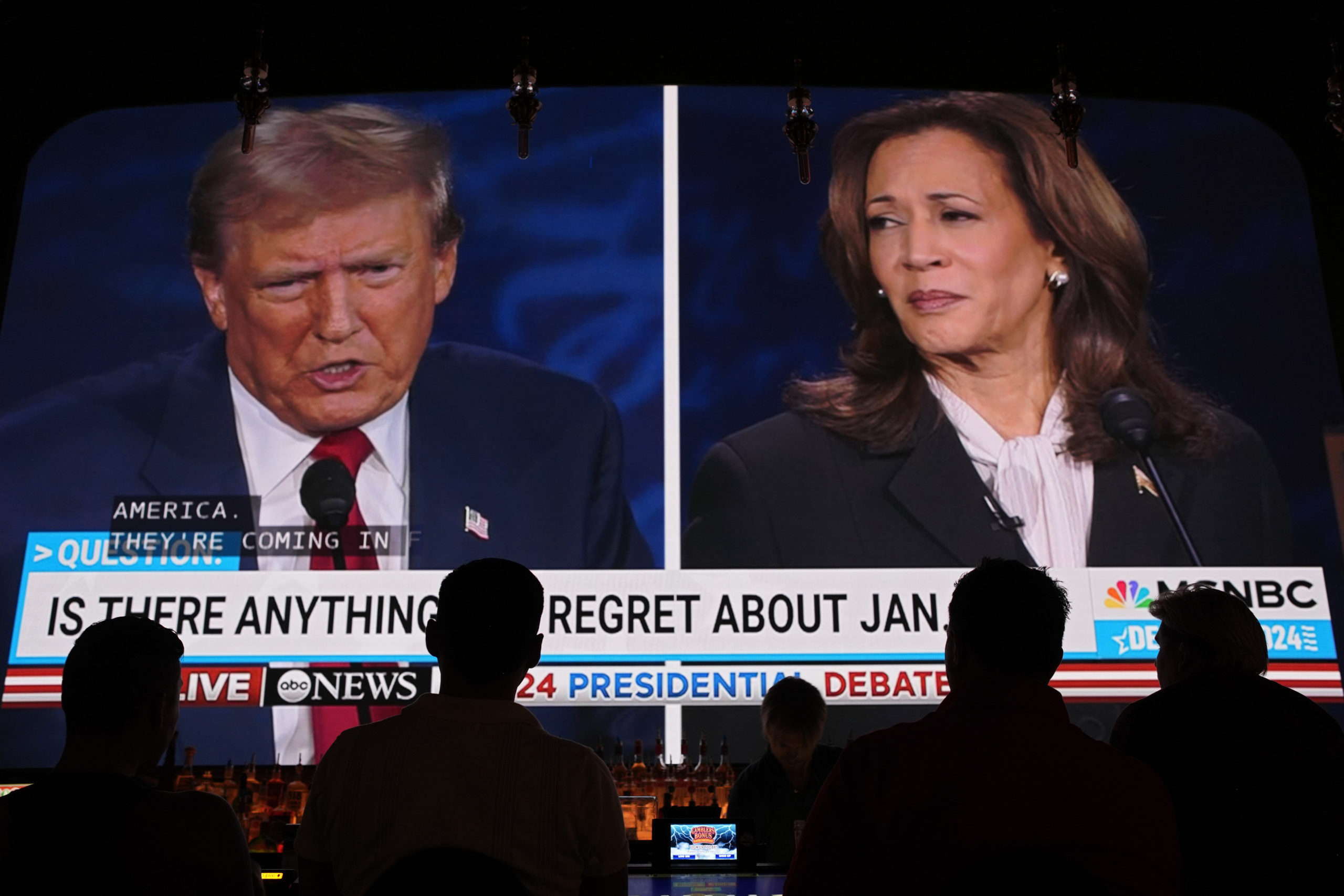 People watch the presidential debate between Republican presidential nominee former President Donald Trump and Democratic presidential nominee Vice President Kamala Harris on Tuesday at the Gipsy Las Vegas in Las Vegas, Nevada.